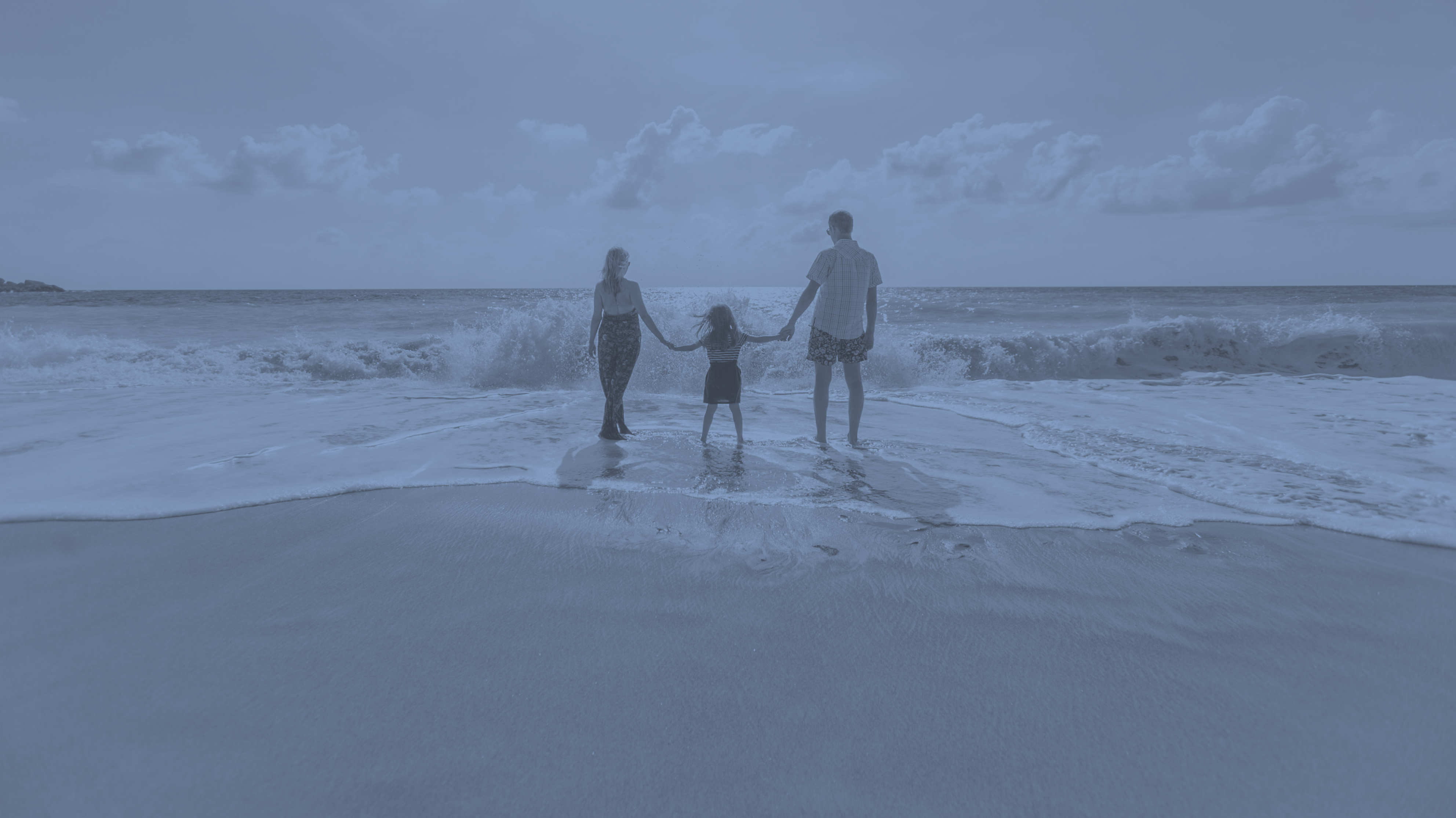 family travellers on beach